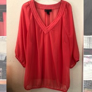 Coral flowy blouse.